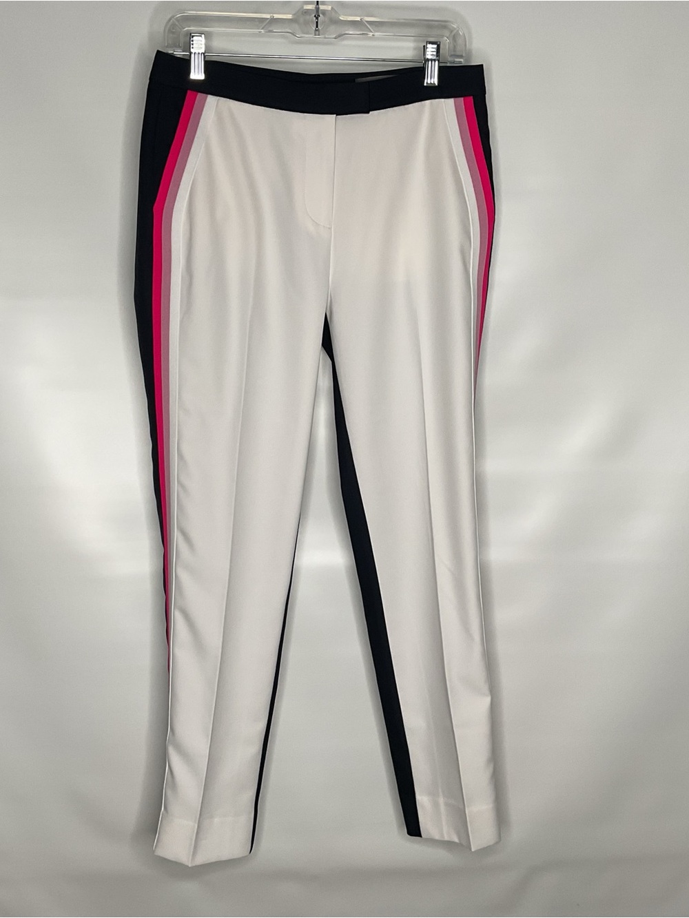 G/FORE White front and navy blue back golf trousers. Luxury golf brand.